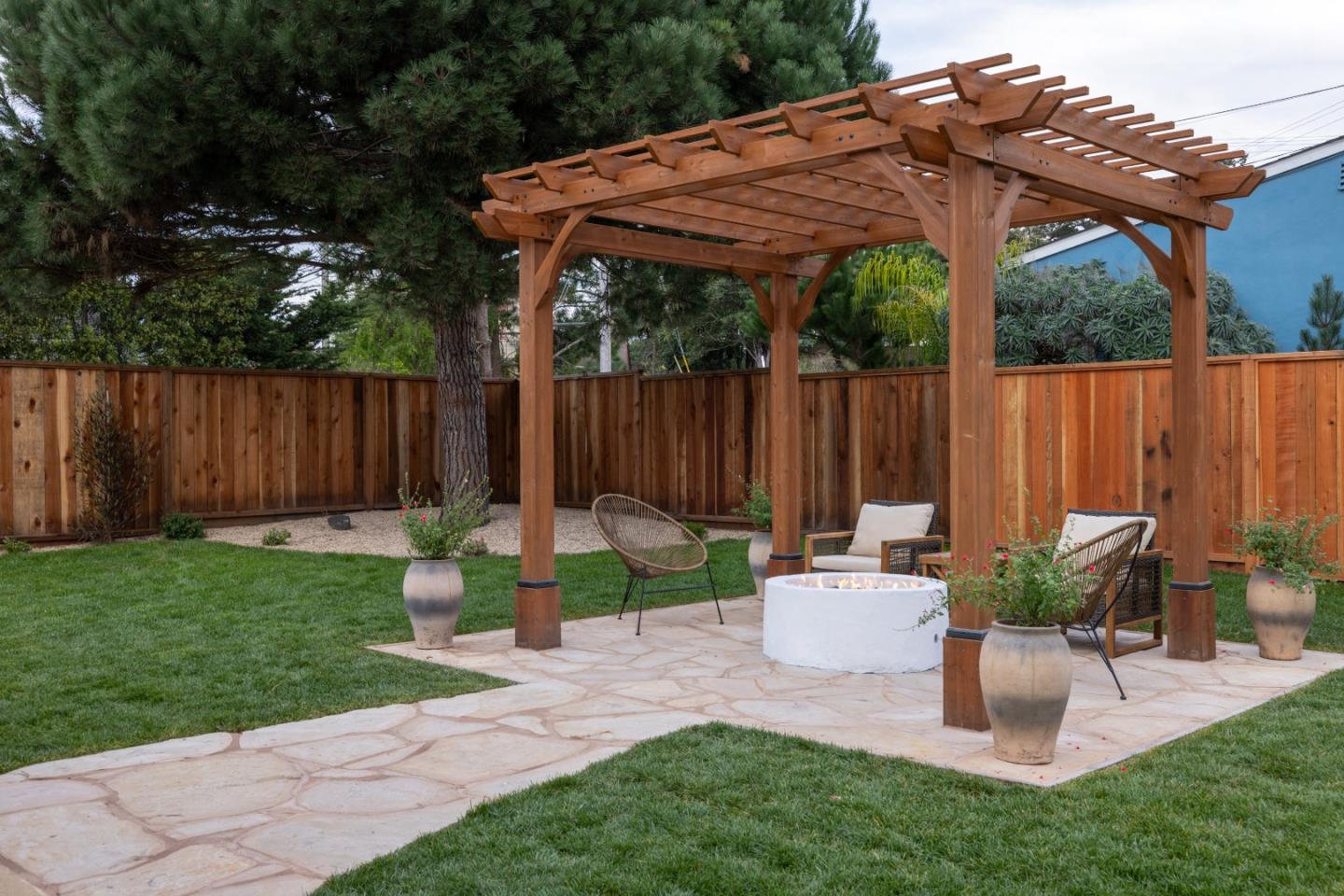 508 4th Street Pacific Grove, CA 93950 - Photo 17 of 20 a garden view with a seating space