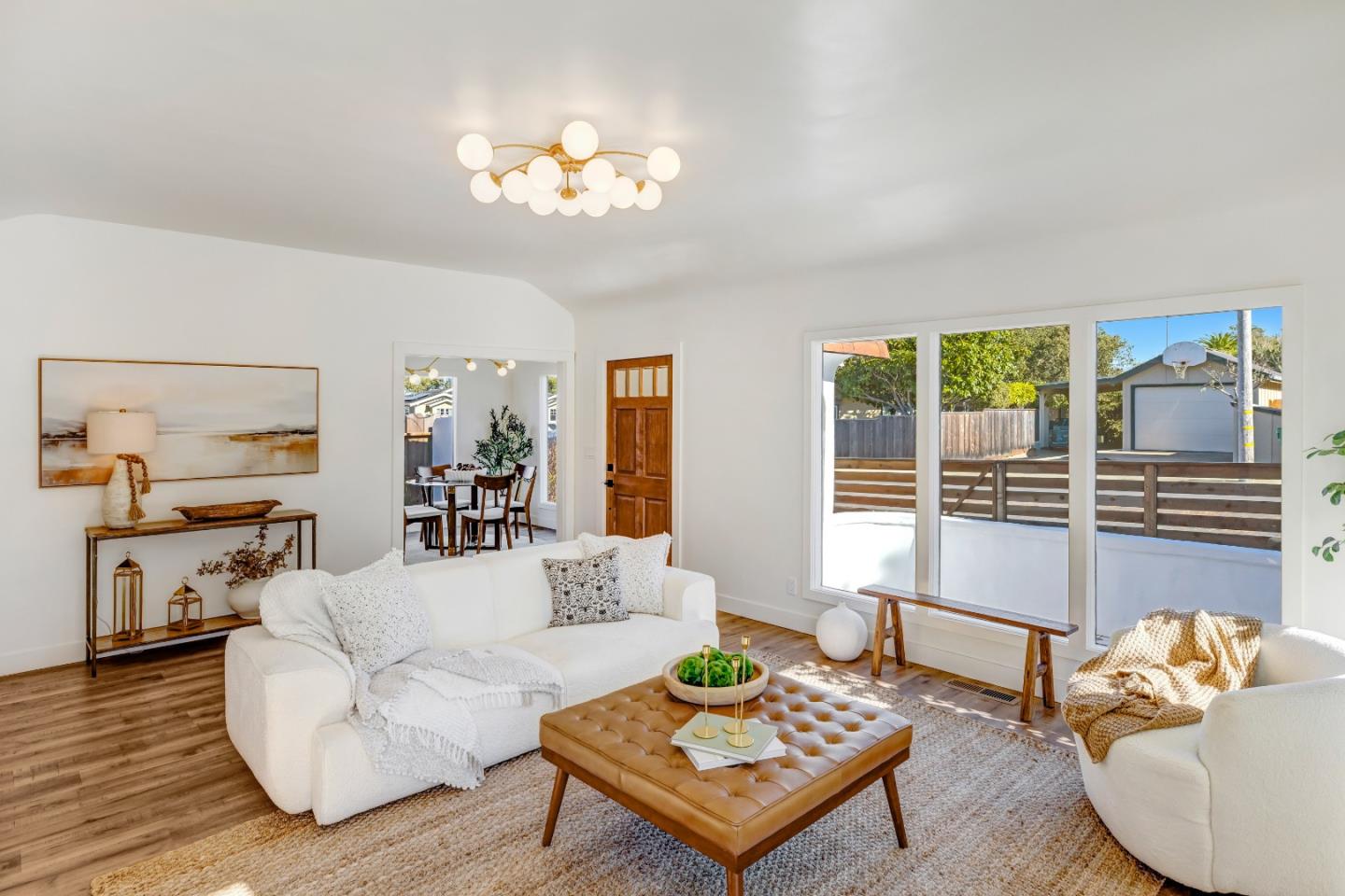 508 4th Street Pacific Grove, CA 93950 - Photo 5 of 20 a living room with furniture and a chandelier