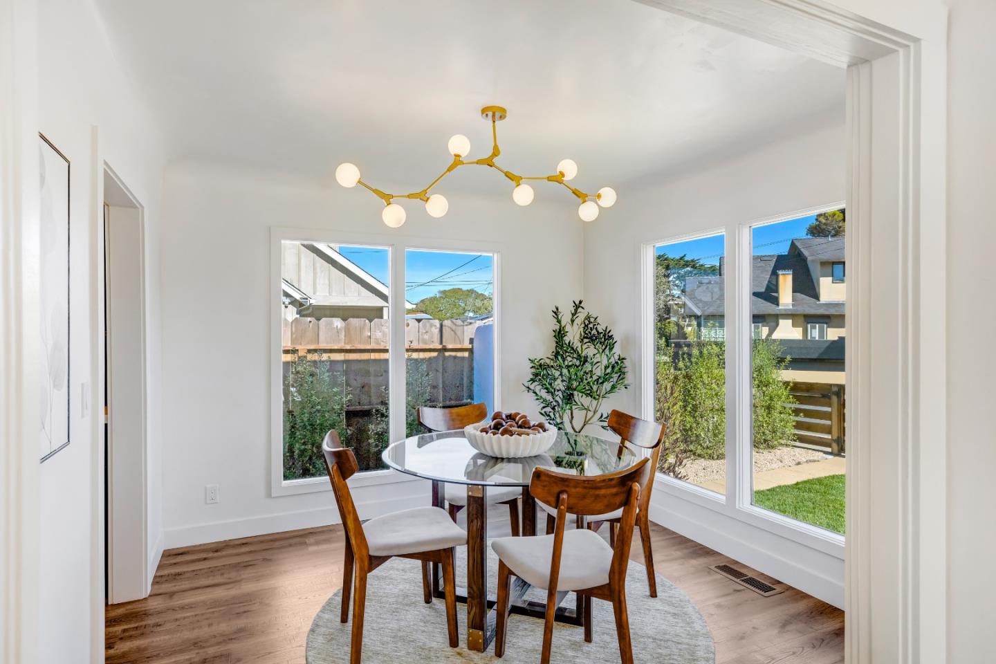 508 4th Street Pacific Grove, CA 93950 - Photo 6 of 20 a dining room with furniture and wooden floor