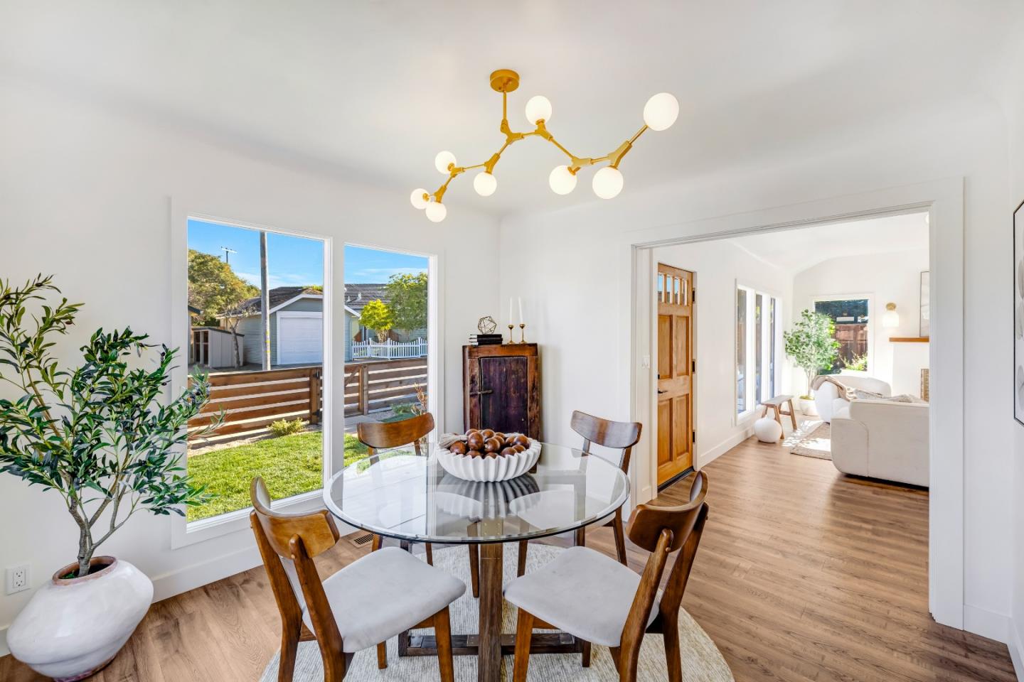 508 4th Street Pacific Grove, CA 93950 - Photo 7 of 20 a dining room with furniture and wooden floor