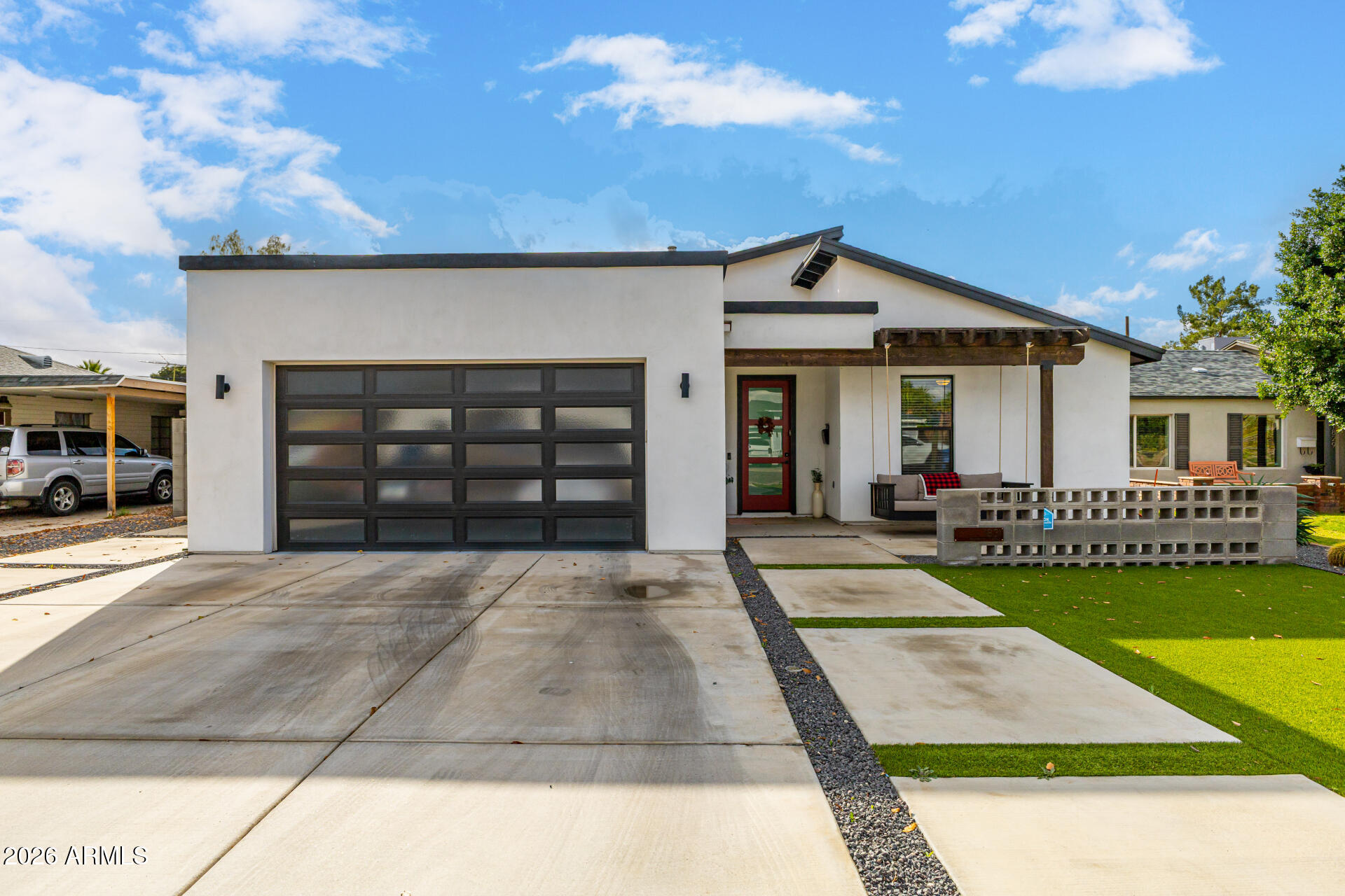 a view of a house with a yard and garage