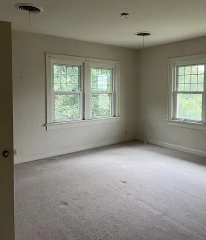 a view of a room that has a large window