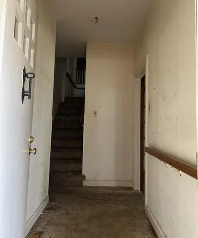 a small pool with a tree in the background