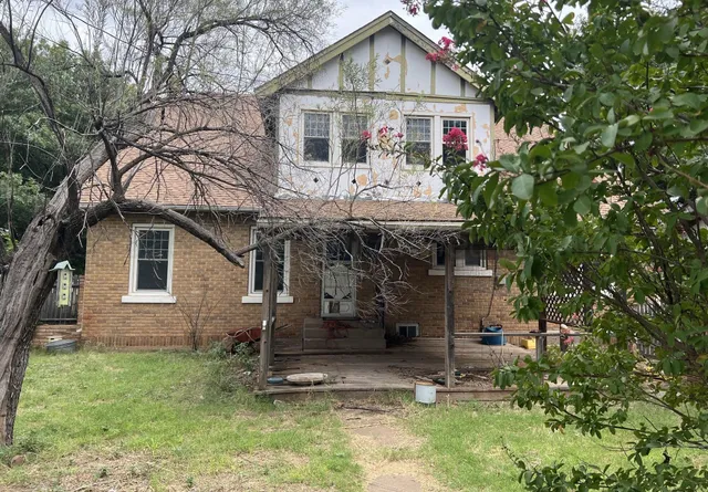 a view of a city with tall trees