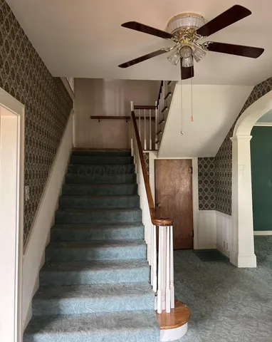 a view of a hallway with windows