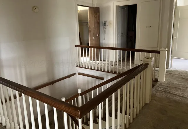 a bedroom with furniture and window