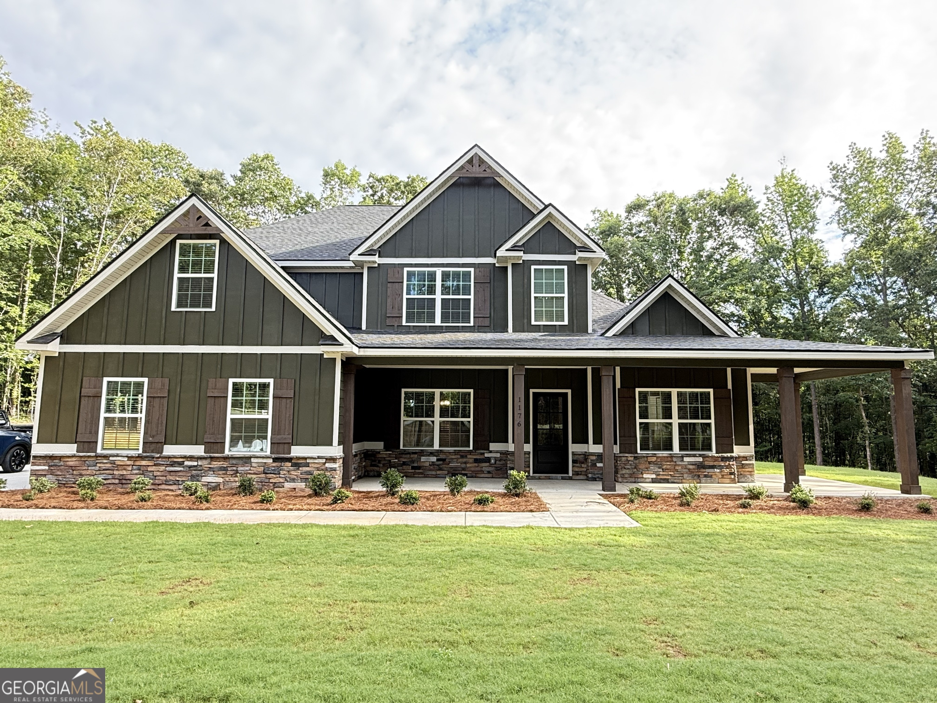 1176 Teagle Road, Unit 5 Forsyth, GA 31029 - Photo 1 of 1 a front view of a house with swimming pool and porch with furniture