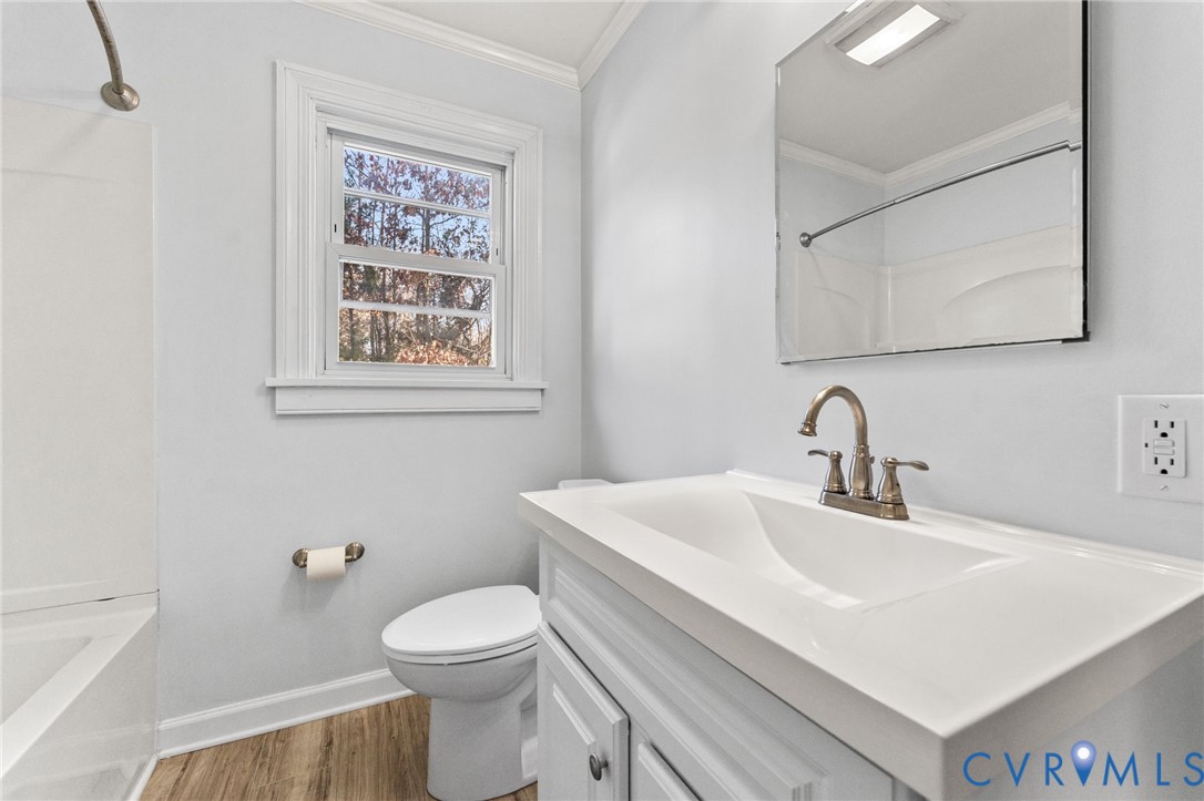 352 3rd Street Emporia, VA 23847 - Photo 16 of 25 a bathroom with a sink a toilet and mirror