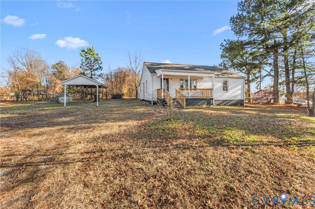 352 3rd Street Emporia, VA 23847 - Photo 25 of 25 a view of a white house next to a yard with big trees