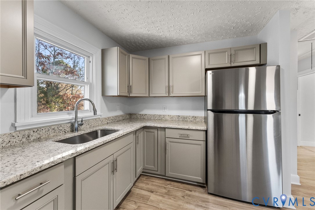 352 3rd Street Emporia, VA 23847 - Photo 7 of 25 a kitchen with stainless steel appliances granite countertop a refrigerator sink and cabinets