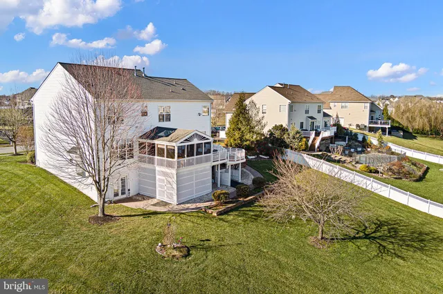 a living room with furniture fireplace and flat screen tv