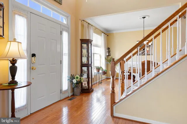 a large kitchen with a table and chairs in it