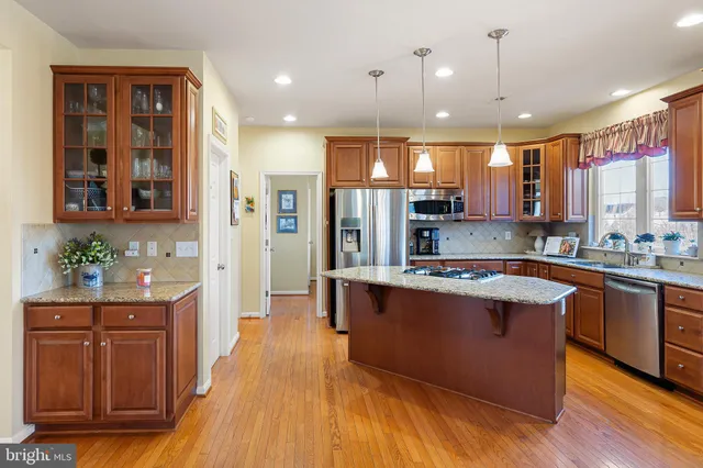 a living room with furniture a rug and a window
