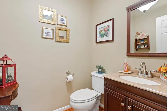a spacious bathroom with a granite countertop tub sink a mirror a vanity and a shower