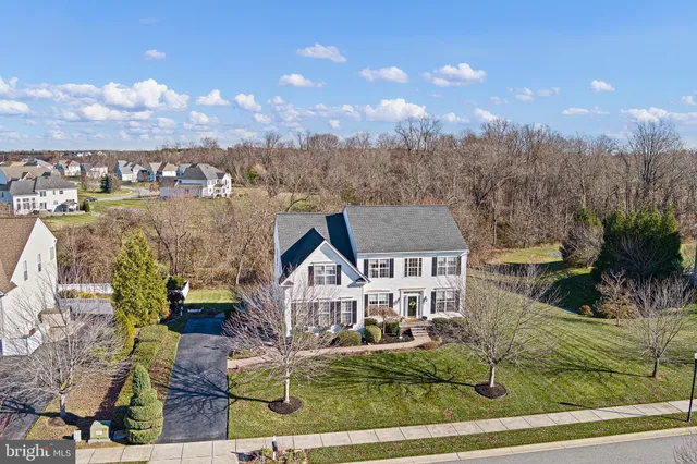 a view of an entryway with wooden floor and windows
