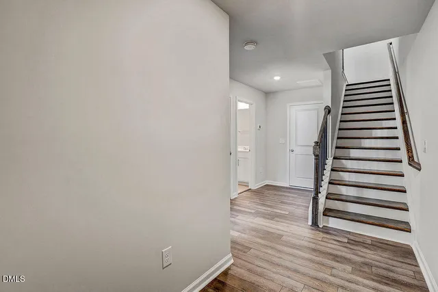 a view of entryway with wooden floor