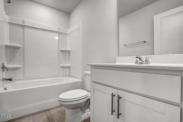 a bathroom with a sink a toilet and a bathtub