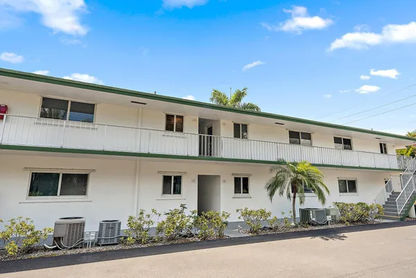a front view of a house with garage