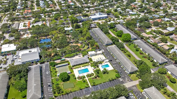 an aerial view of a house with a garden