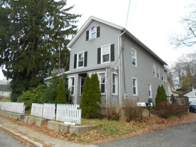 21 Ward Street Norwalk, CT 06851 - Photo 1 of 1 a view of a white house with large windows and a small yard