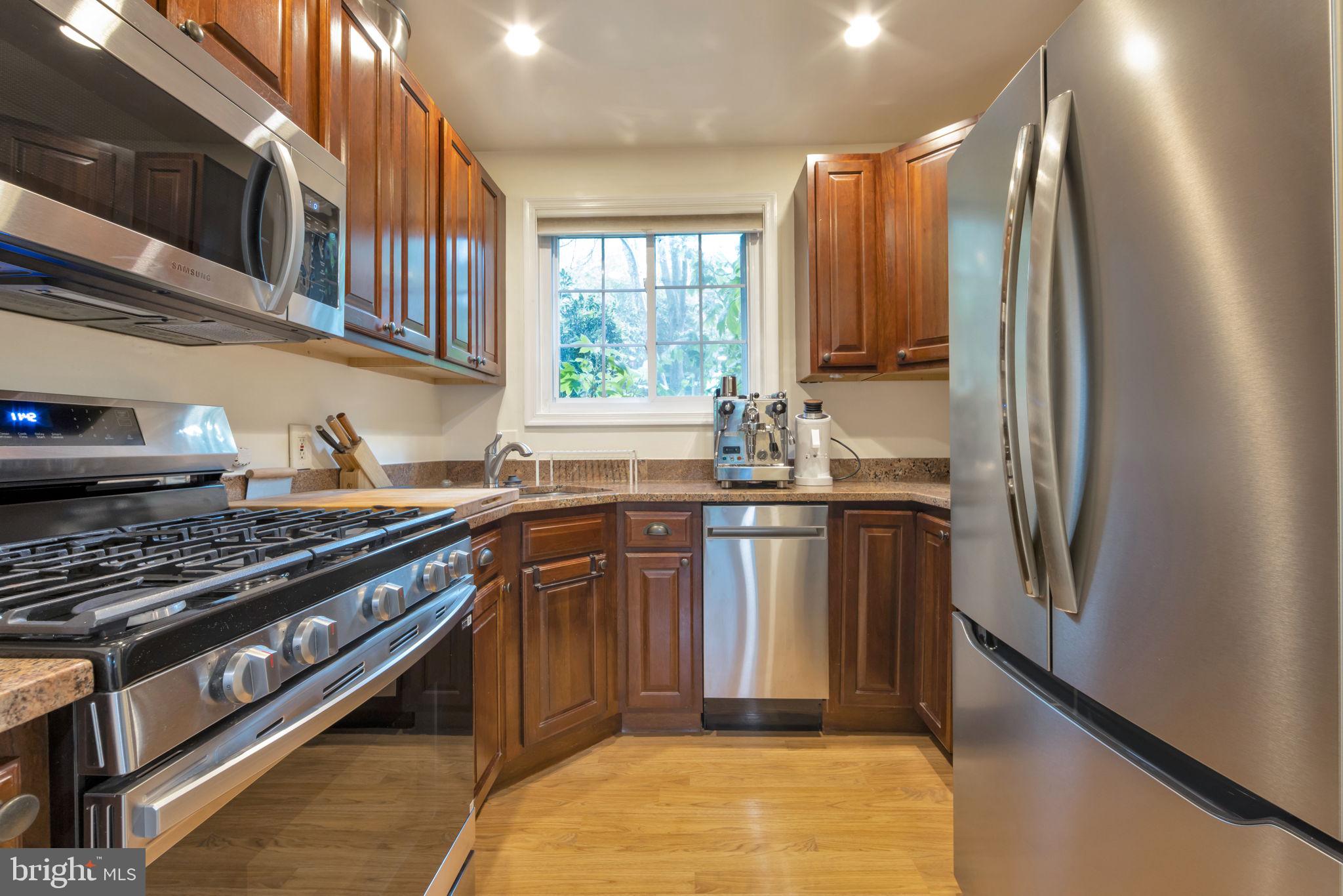 3400 Gunston Road Alexandria, VA 22302 - Photo 6 of 15 Modern kitchen with rich wood tones.