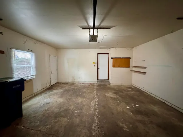 a view of empty room with windows