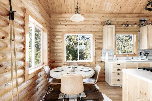 a dining room with a window and table