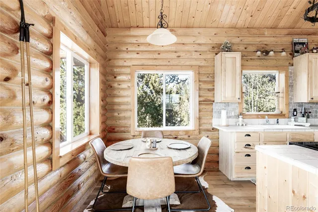 a dining room with a window and table