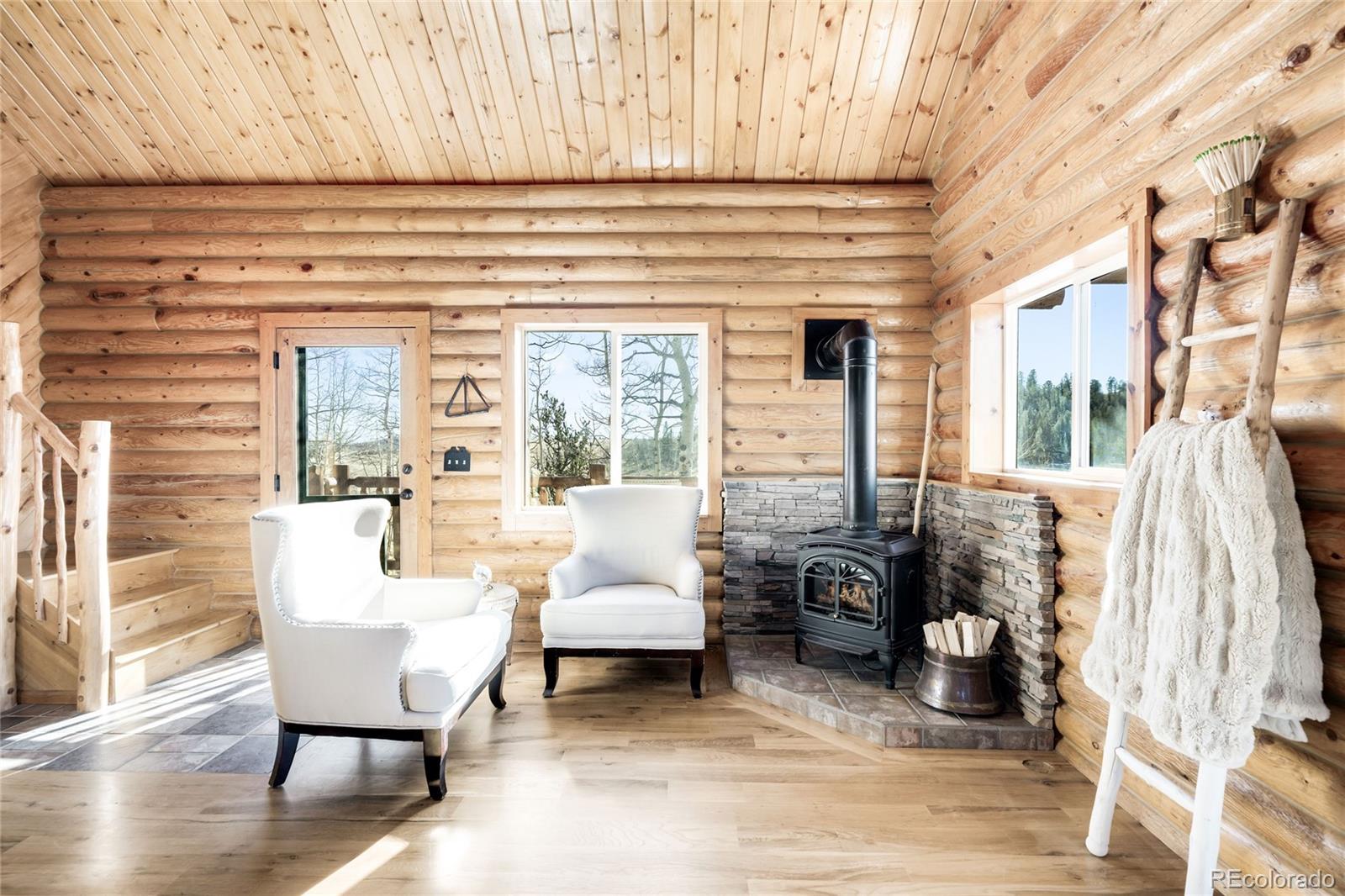 43 Pintail Way Como, CO 80432 - Photo 13 of 48 a living room with furniture and a window