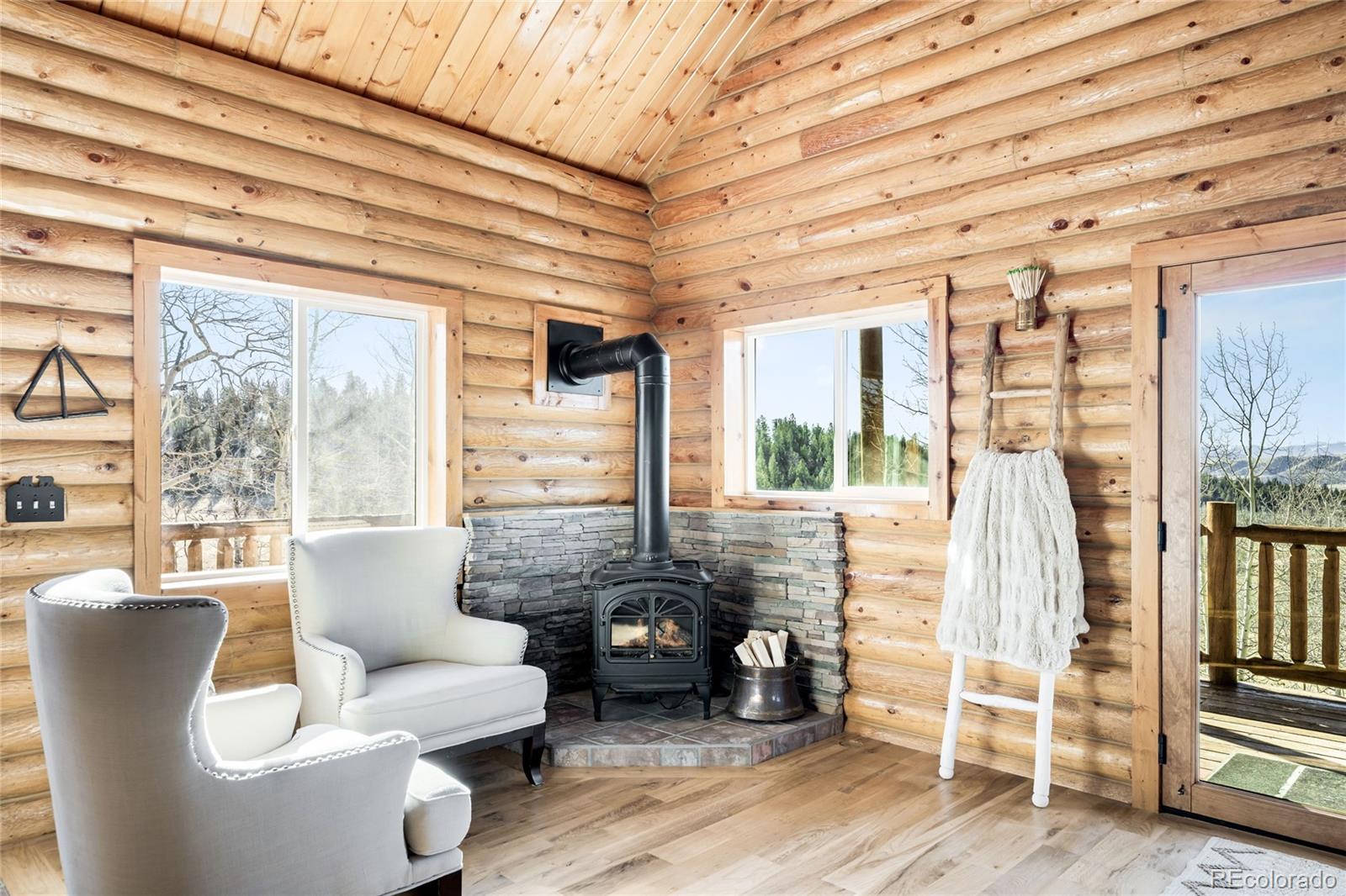 43 Pintail Way Como, CO 80432 - Photo 14 of 48 a living room with furniture and large windows