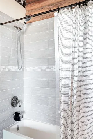 a bathroom with a sink and a shower