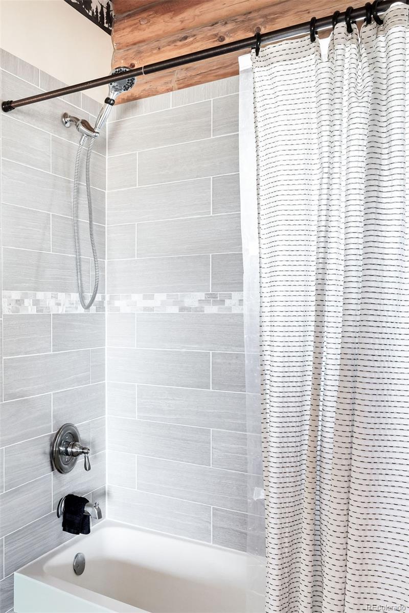 43 Pintail Way Como, CO 80432 - Photo 19 of 48 a bathroom with a sink and a shower