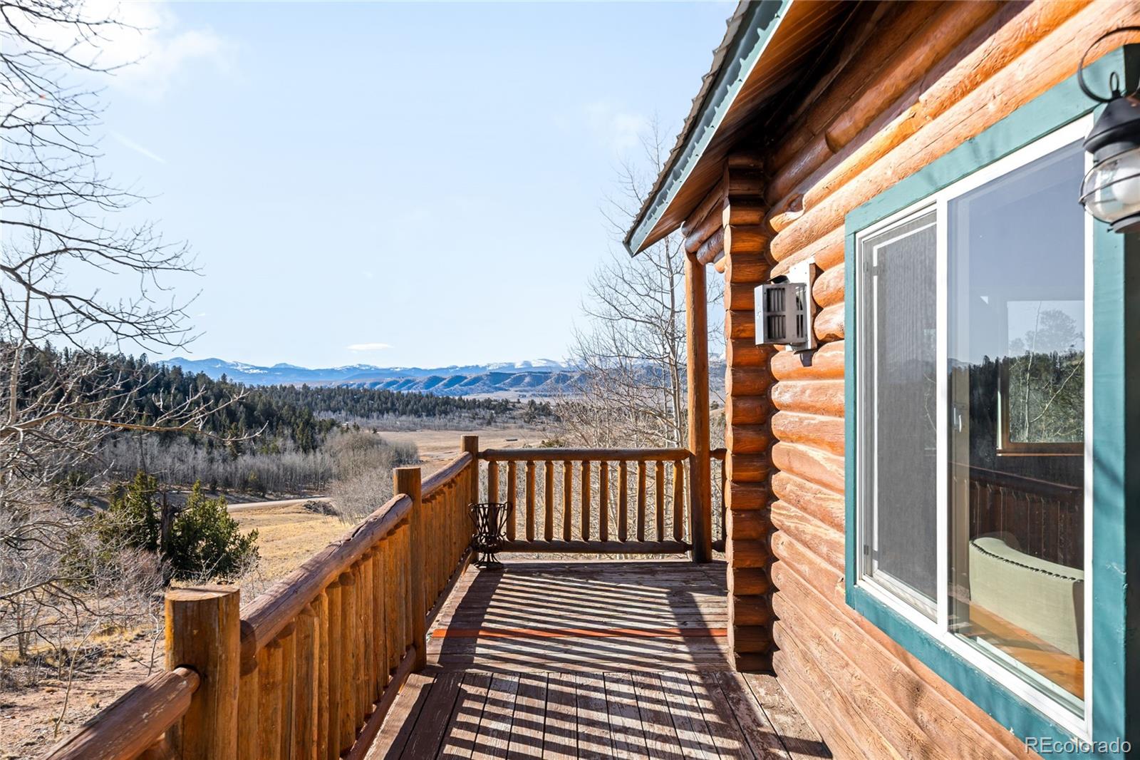 43 Pintail Way Como, CO 80432 - Photo 2 of 48 a balcony with wooden floor and lake view