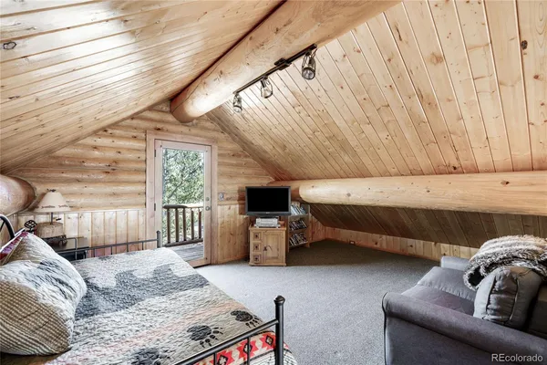 a bedroom with furniture and a couch