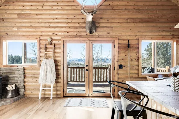 a view of a chairs and table in a patio