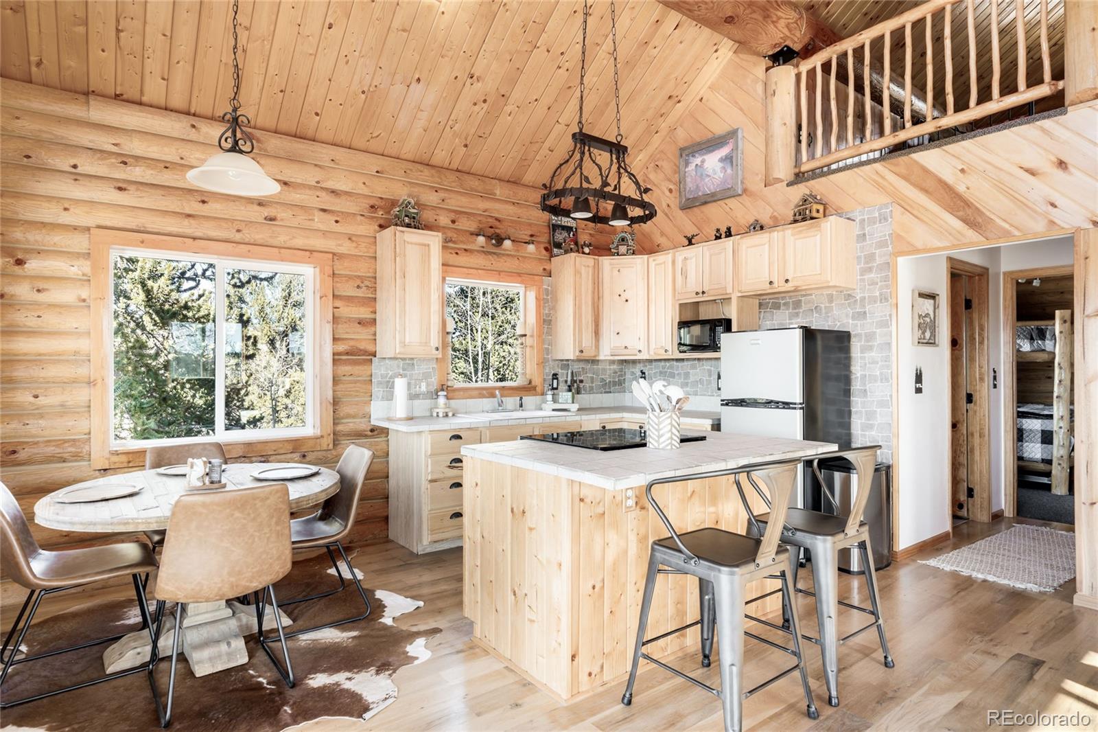 43 Pintail Way Como, CO 80432 - Photo 8 of 48 a view of a dining room with furniture window and outside view