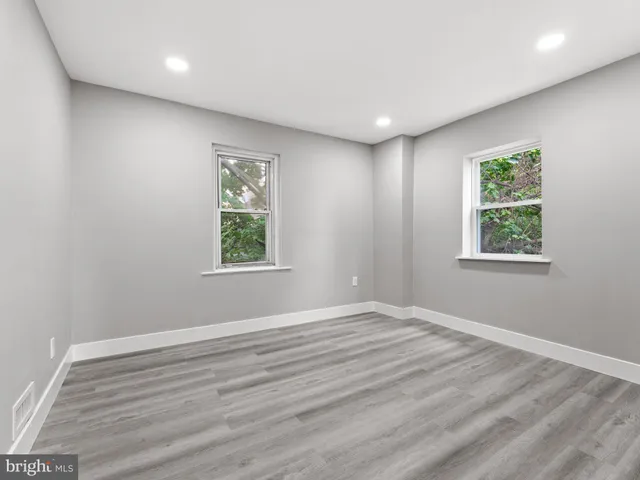 a view of room with window and hardwood floor