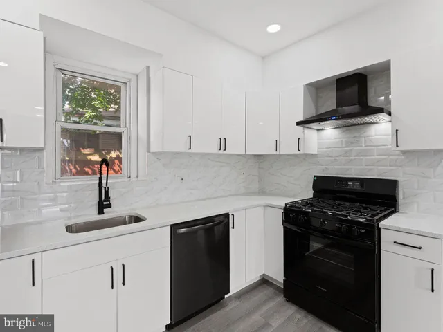 a kitchen with a stove and a microwave