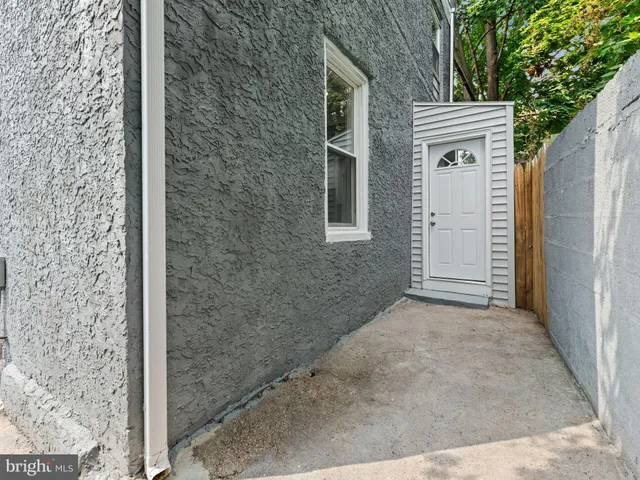 a view of an empty room with stairs