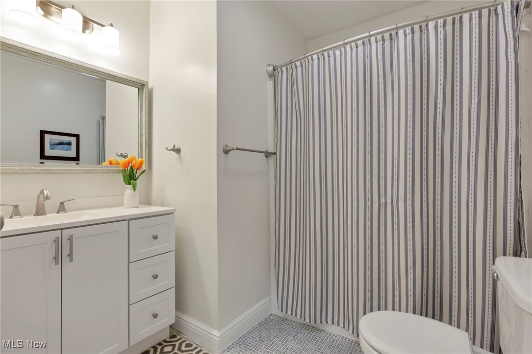 1890 Baltimore Road Northwest Lancaster, OH 43130 - Photo 9 of 50 Bathroom with vanity, toilet, and tile patterned floors