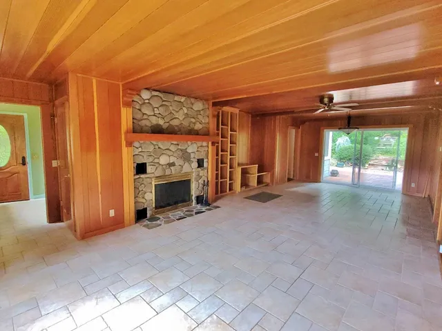 a spacious bathroom with a shower sink and mirror