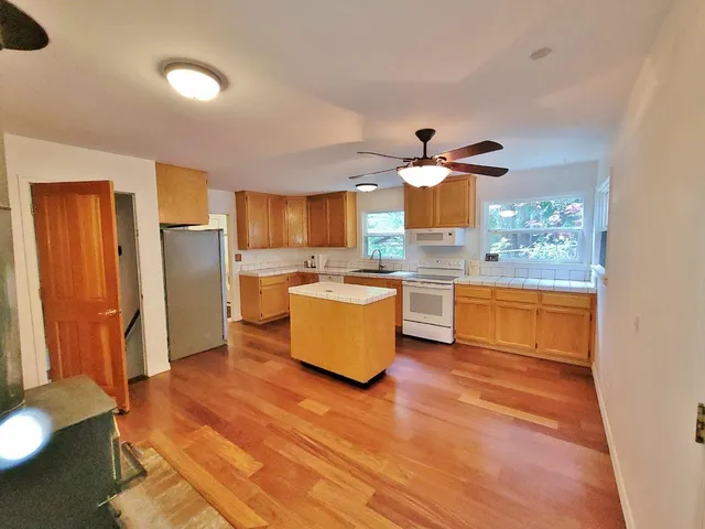 a view of room with window and furniture
