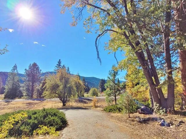a view of an empty room with a fireplace