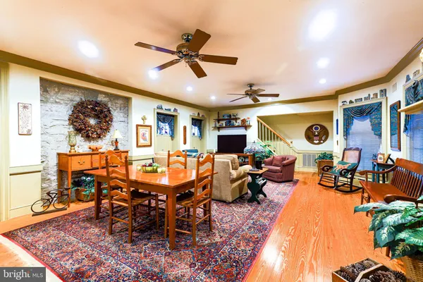 a view of a livingroom with furniture and a window