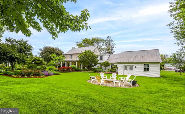 a view of a house with a yard porch and sitting area