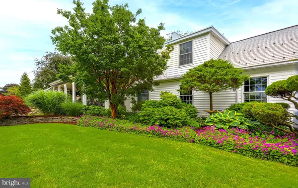 a view of a house with garden and plants