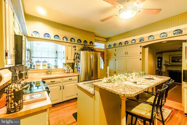 a kitchen with a table and chairs