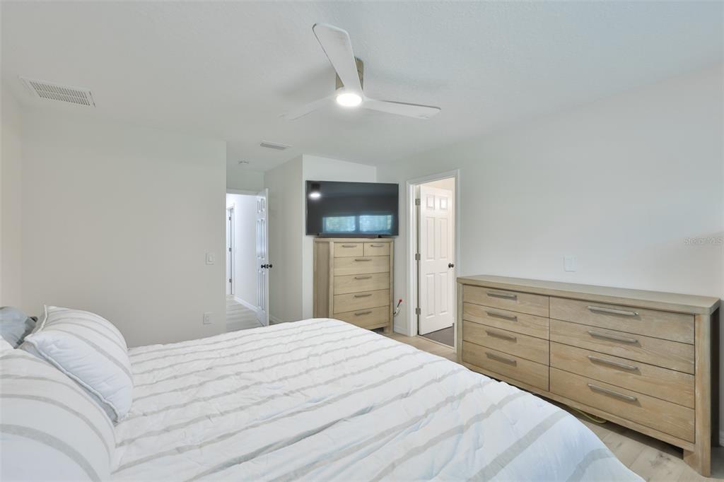 1578 Indian Bay Road Spring Hill, FL 34607 - Photo 25 of 51 a bedroom with a bed and a dresser