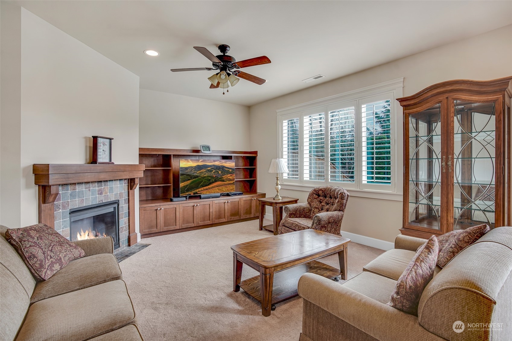 6127 Southeast 2nd Street Renton, WA 98059 - Photo 7 of 33 a living room with furniture ceiling fan and a fireplace