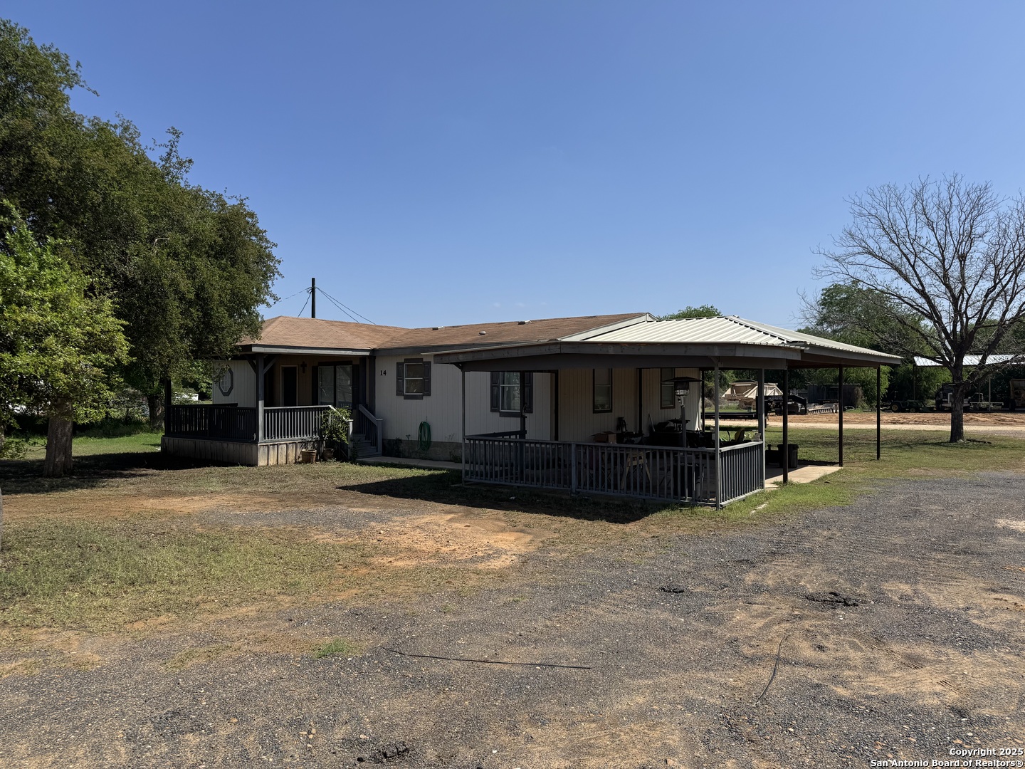 606 North Main Street Cotulla, TX 78014 - Photo 1 of 14 a front view of a house with a yard